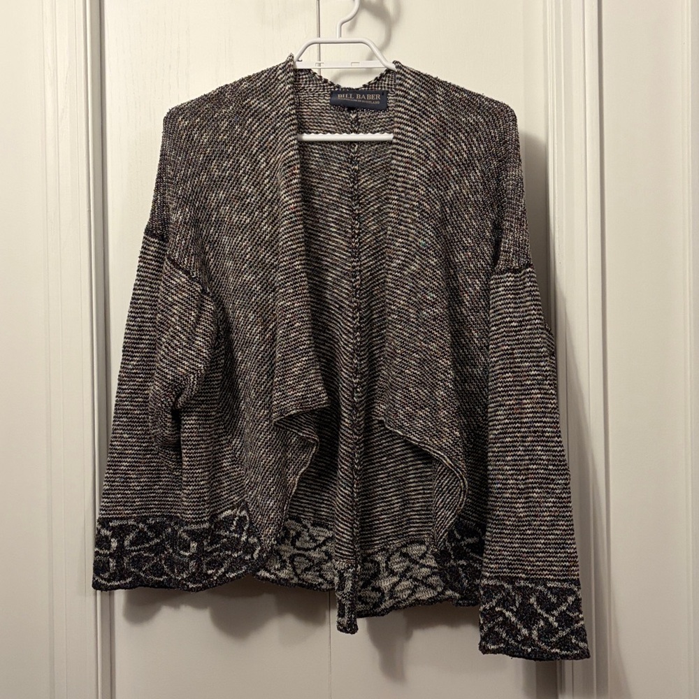 Lovely Multi coloured open cardigan.
Made in Scotland
Ptp27